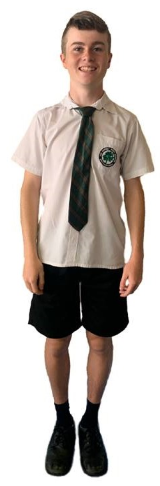 Male student wearing black shorts with school shirt and tie.